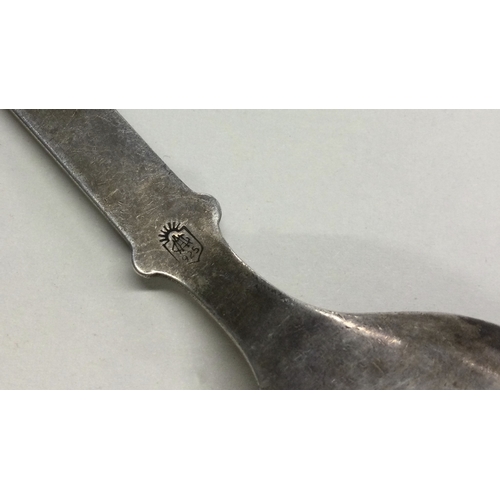 7 - An Antique Art Nouveau silver spoon with chased decoration. Approx. 24 grams. Est. £30 - £40.
