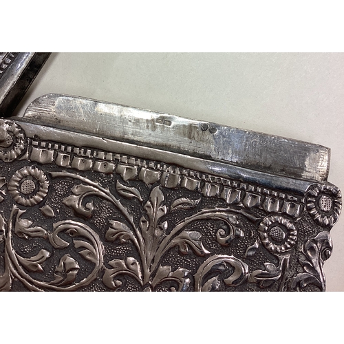 66 - A 19th Century Indian Kutch silver card case with chased decoration. Marked inside. Approx. 84 grams... 