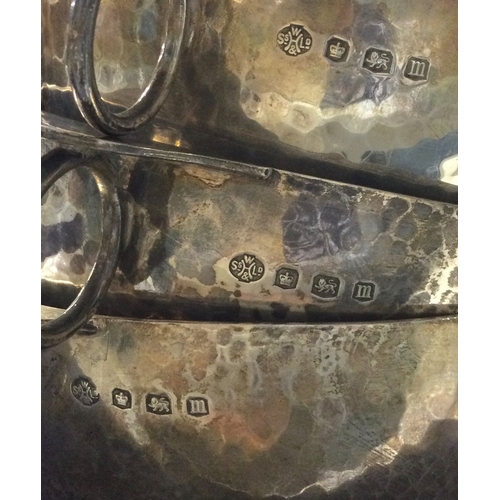 61 - A good set of three tapering silver bowls of textured form. Sheffield.  Approx. 386 grams. Est. £120... 