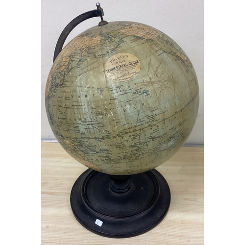 1 - A globe on wooden stand. Est. £20 - £30.