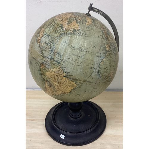 1 - A globe on wooden stand. Est. £20 - £30.