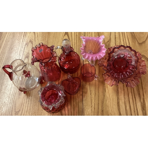 109 - A collection of cranberry glassware. Est. £20 - £30.