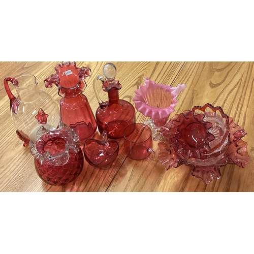 109 - A collection of cranberry glassware. Est. £20 - £30.