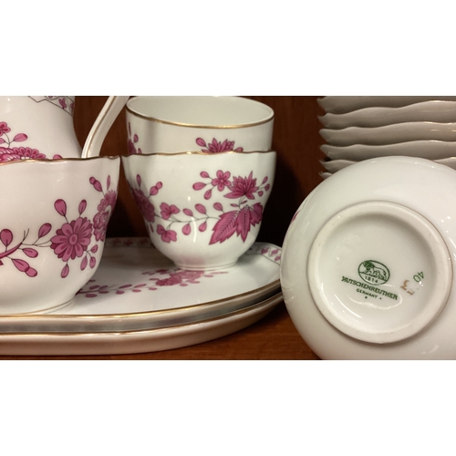 131 - A decorative floral tea service. Est. £20 - £30.