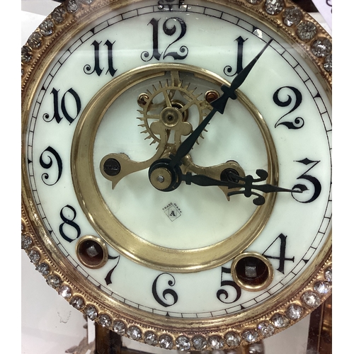 168 - A large French clock with scroll decoration. Est. £80 - £100.