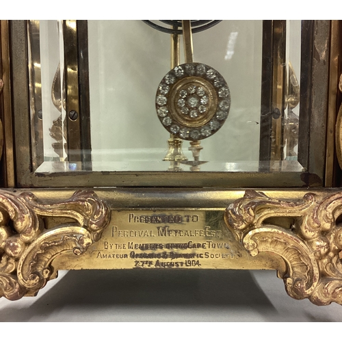 168 - A large French clock with scroll decoration. Est. £80 - £100.