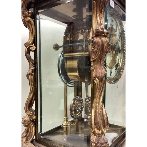 168 - A large French clock with scroll decoration. Est. £80 - £100.