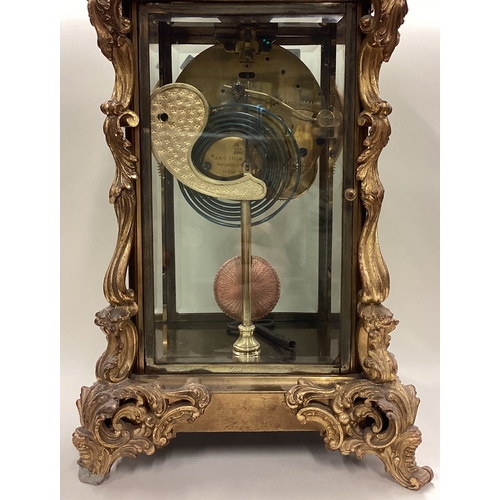 168 - A large French clock with scroll decoration. Est. £80 - £100.