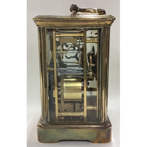 170 - A large brass carriage clock with white enamelled dial. Est. £50 - £80.