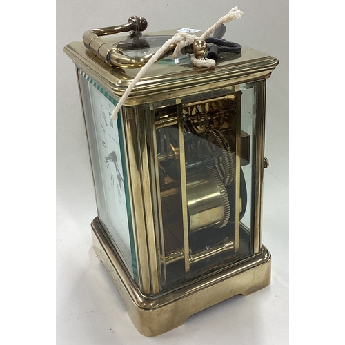 170 - A large brass carriage clock with white enamelled dial. Est. £50 - £80.