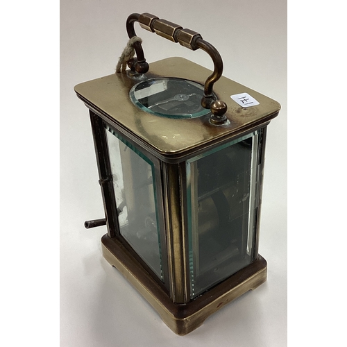 171 - A small brass carriage clock with white enamelled dial. Est. £30 - £50.