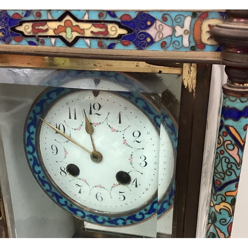 174 - A large Continental brass and enamelled clock decorated in bright colours. Est. £50 - £80.