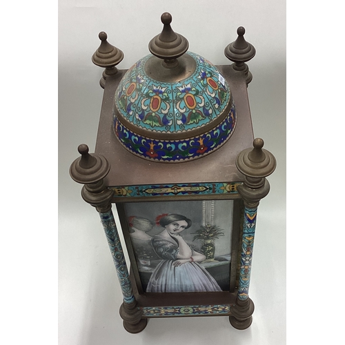 174 - A large Continental brass and enamelled clock decorated in bright colours. Est. £50 - £80.