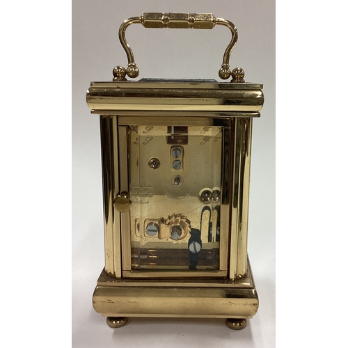 175 - A good brass miniature carriage clock. Est. £30 - £50.