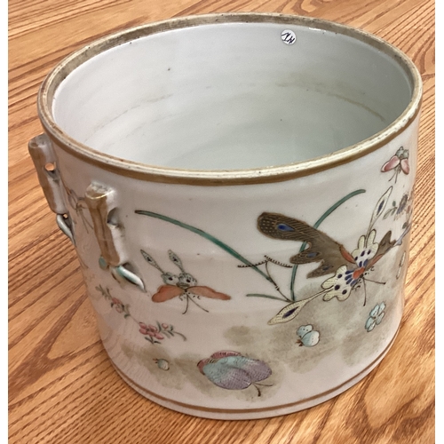 214 - A large cylindrical Chinese basket decorated with flowers and bright colours. Est. £50 - £80.