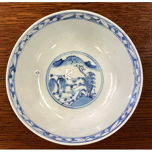 224 - A Nanking blue and white dish of typical form. Signed to base. Est. £30 - £50.