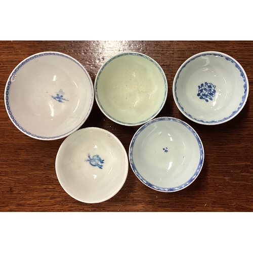 229 - A group of five Nanking blue and white dishes. Est. £30 - £50.