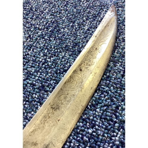 283 - An old Burmese sword. Est. £20 - £30.