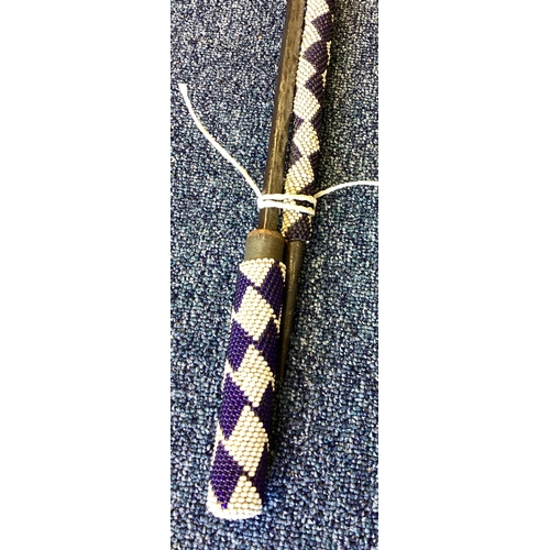 291 - An unusual decorated spear and axe. Est. £20 - £30.