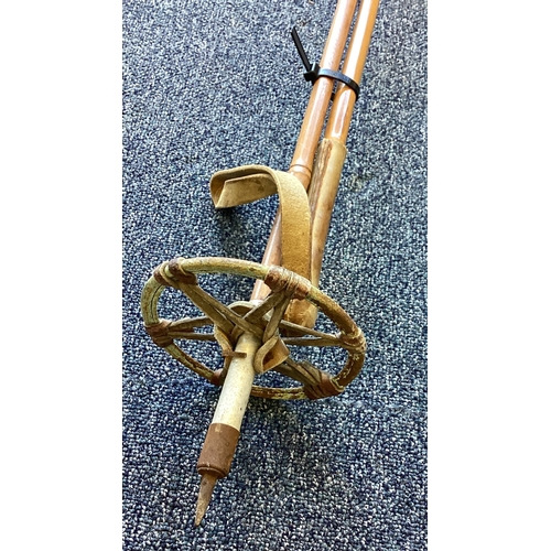 301 - A pair of vintage ski poles. Est. £20 - £30.