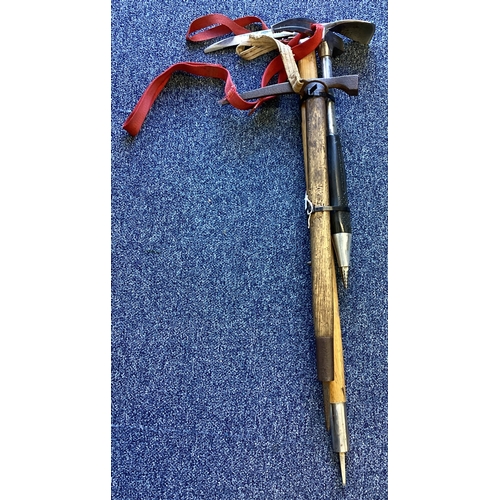 304 - Two climbing axes together with an ice pick. Est. £20 - £30.