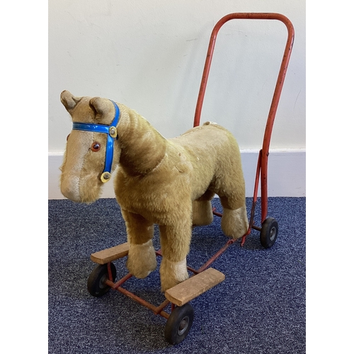 308 - A small push along toy horse. Est. £20 - £30.