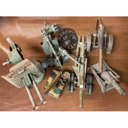 313 - A collection of old toy Military guns etc. Est. £20 - £30.