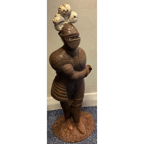 373 - A cast iron door stop in the form of a soldier. Est. £20 - £30.