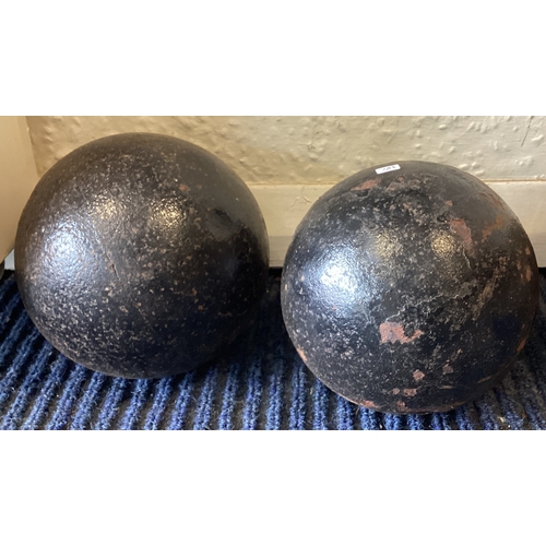 382 - Two old cannon balls. Est. £20 - £30.