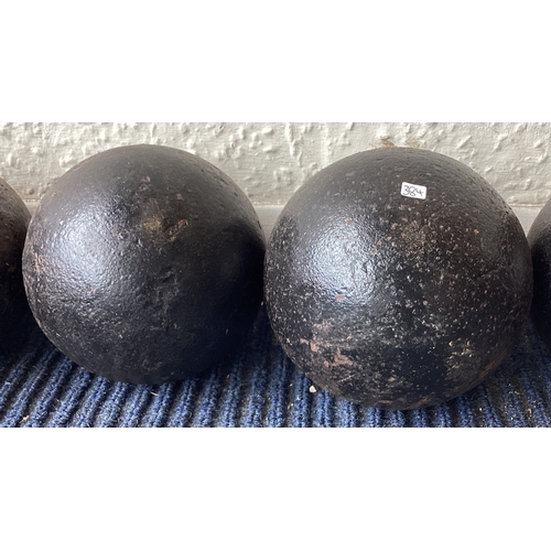 384 - Two old cannon balls. Est. £20 - £30.