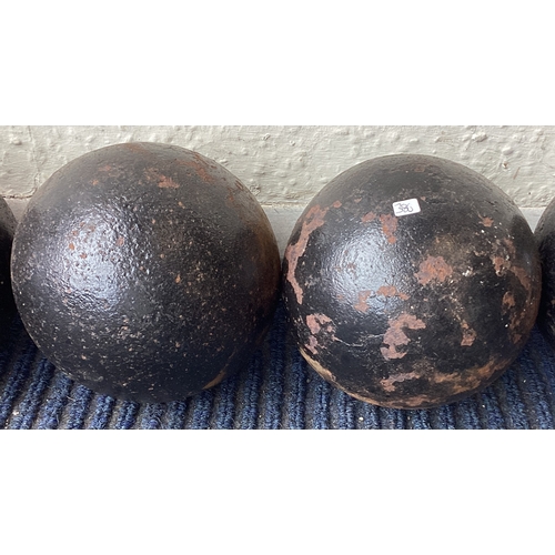 386 - Two old cannon balls. Est. £20 - £30.