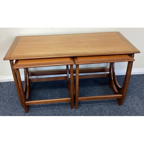 433 - A stylish nest of three tables. Est. £20 - £30.