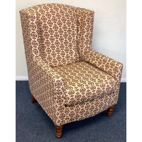 437 - A good upholstered wingback chair. Est. £50 - £80.