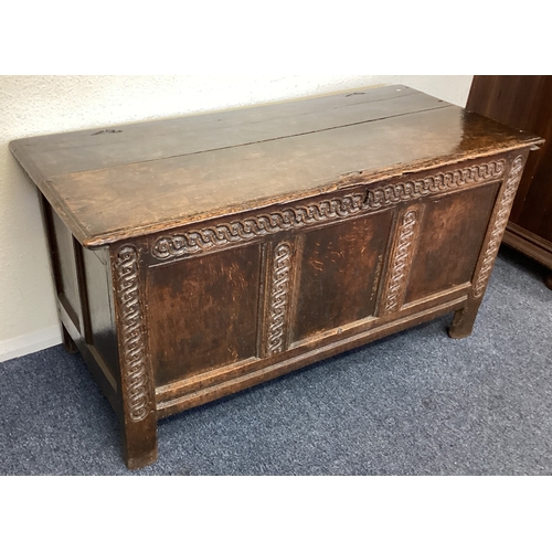 439 - A Georgian oak three-panelled coffer. Est. £100 - £150.