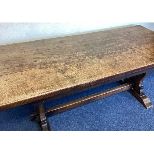 452 - A good oak plank top table. Est. £100 - £150.