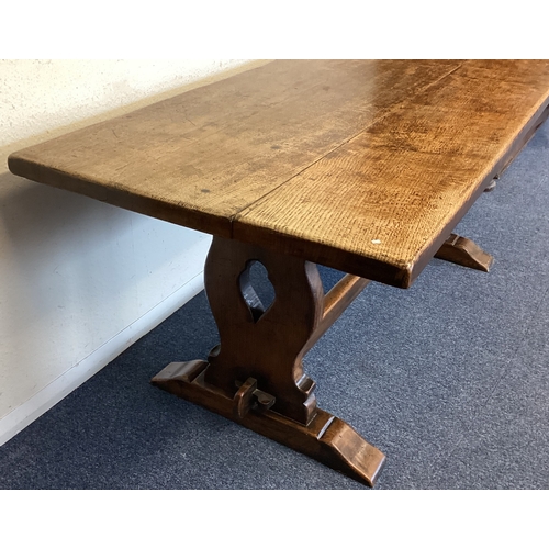 452 - A good oak plank top table. Est. £100 - £150.