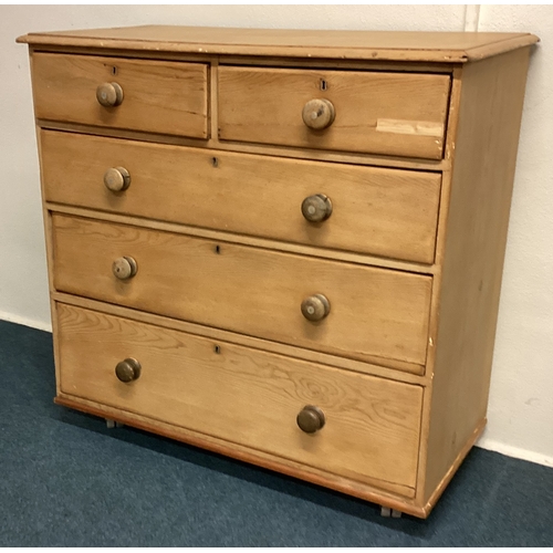 457 - A stripped pine chest of five drawers. Est. £80 - £120.