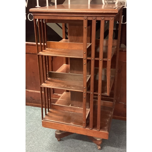 493 - A large revolving bookcase. Est. £50 - £80.