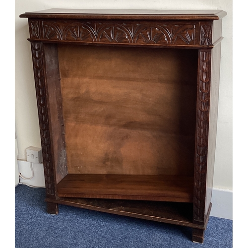 521 - An oak carved bookcase. Est. £20 - £30.