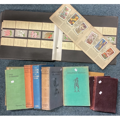 69 - A collection of leather-bound books and cigarette cards. Est. £30 - £50.