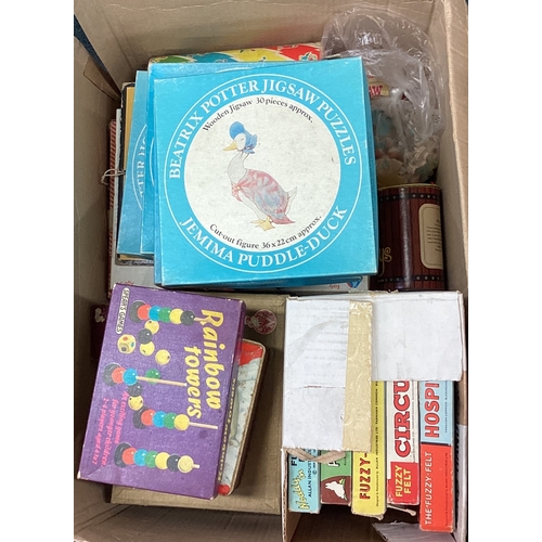 7 - A box containing old children's games including Fuzzyfelt, Beatrix Potter jigsaw puzzle etc. Est. £2... 