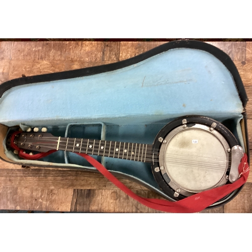 79 - A cased John Grey banjo musical instrument. Est. £20 - £30.