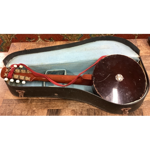 79 - A cased John Grey banjo musical instrument. Est. £20 - £30.