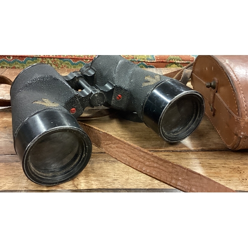 80 - A pair of military binoculars in carrying case. Est. £20 - £30.