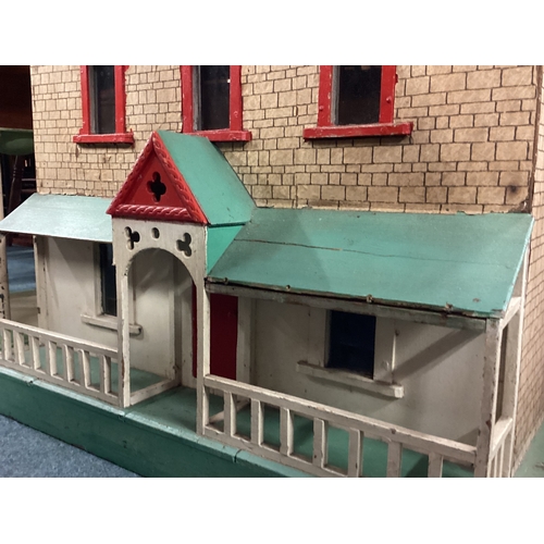 96 - An old painted doll's house. Est. £50 - £80.