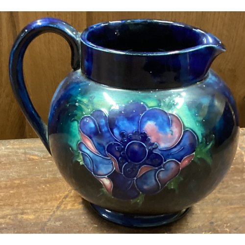 146 - MOORCROFT: A jug with floral decoration. Est. £20 - £30.