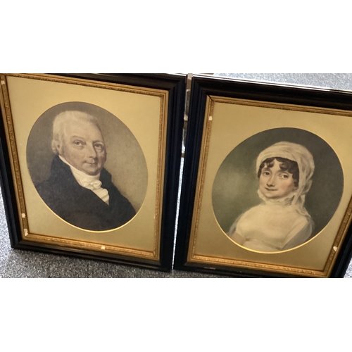 407 - A pair of framed and glazed portraits of a lady and a gentleman in oval mounts. Approx. 25 cms x 29 ... 