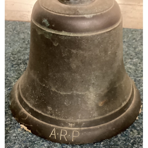 549 - An old air raid bell together with a pottery jug etc. Est. £30 - £50.