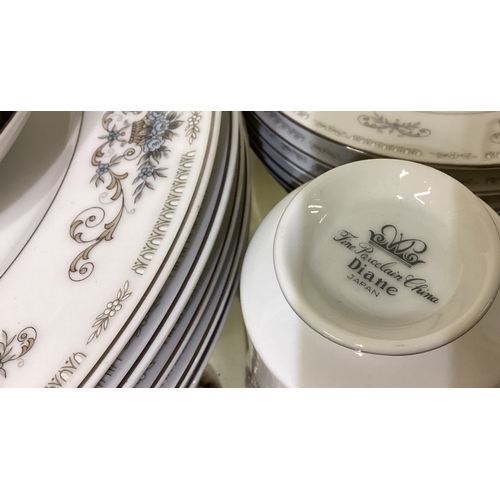 180 - A Diane pattern porcelain dinner / tea set. Est. £20 - £30.