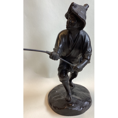 213 - A good Chinese bronze of a gent fishing. Seal mark to base. Est. £200 - £300.